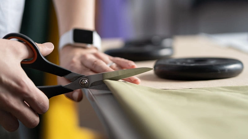 Using scissors to cut fabric is a classic fabric-cutting technique for tailors and home sewists